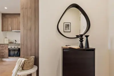 a living room with a table and chairs at Isora - 1 bedroom in El Gòtic in Barcelona