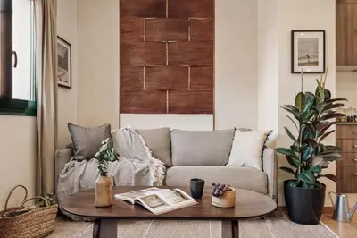 a kitchen with wooden cabinets and a sink at Isora - 1 bedroom in El Gòtic in Barcelona