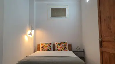 a bedroom with a bed and a picture on the wall at Miro Park céntrico 5pax in Barcelona