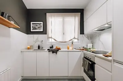 a dining room with a table and chairs at Sabre - 2 bedrooms and office in Gràcia in Barcelona