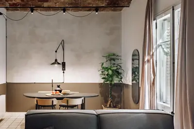a living room with a brick wall at Sabre - 2 bedrooms and office in Gràcia in Barcelona