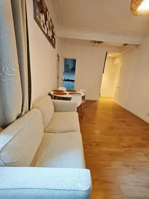a living room with a couch and a table at Confort y Calma en Barcelona in Barcelona