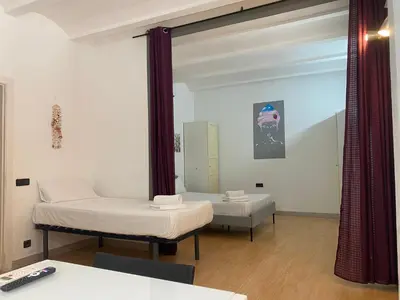 a hospital room with two beds and a mirror at Gracia&Güell Home in Barcelona