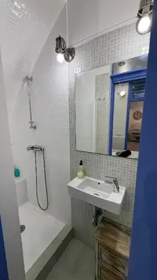 a bathroom with a sink and a shower at Cosy apartment next to the sea in Barcelona