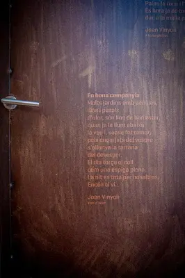 a wooden door with a metal handle on it at Cal Magí in San Martín Sarroca