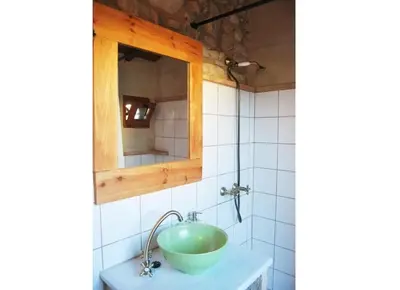 a bathroom with a sink and a mirror at Casa rural Cal Farriol in Mediona
