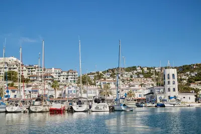 a bunch of boats are docked in a harbor at Benet Sitges in Sitges
