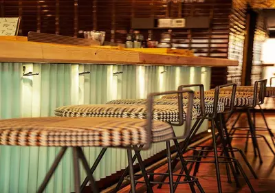 a table with four chairs at a bar at Sixties Ramblas in Barcelona