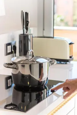 a pot sitting on top of a stove at Glorious Sunny penthouse near the beach in Barcelona