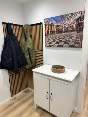 a room with a white cabinet and a picture on the wall at Habitación premium in Vilanova i la Geltrú