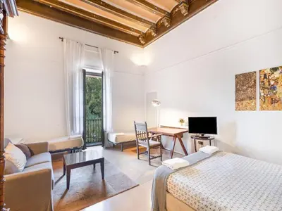a living room with a couch and a bed at Farmhouse in Anoia near Montserrat in Capellades