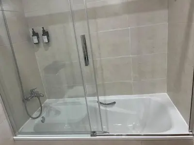 a shower with a white tub in a bathroom at Holiday near Sitges with private terrace in Vilanova i la Geltrú