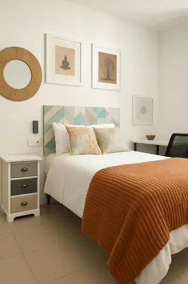 a bedroom with a bed and a mirror on the wall at Barcelona's Gem in Barcelona