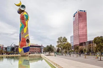 a statue of a person with a moon in a fountain at Sweett - Calabria in Barcelona
