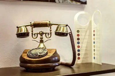 an old fashioned telephone sitting on a table at Sweett - Urqui City Center in Barcelona