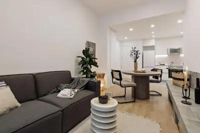 a bathroom with a toilet and a glass shower at Capaccio - 2 bedrooms and terrace in Ciutat Vella in Barcelona