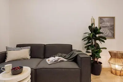 a living room with a couch and a table at Capaccio - 2 bedrooms and terrace in Ciutat Vella in Barcelona
