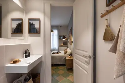 a bathroom with a sink and a shower at Bawah - 2 bedrooms in Eixample Esquerra in Barcelona