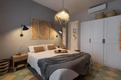 a living room with a couch and a table at Bawah - 2 bedrooms in Eixample Esquerra in Barcelona
