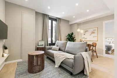 a white bedroom with a bed with a tray on it at Acciaroli - 2 bedrooms and terrace in Ciutat Vella in Barcelona