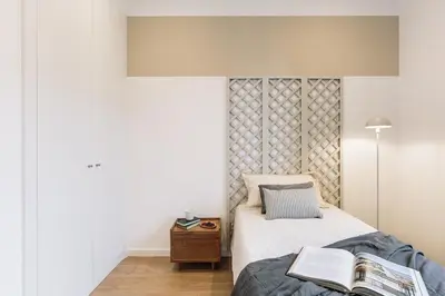 a bedroom with a bed with a book on it at Acciaroli - 2 bedrooms and terrace in Ciutat Vella in Barcelona