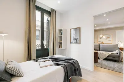 a bedroom with a large bed with a tray on it at Acciaroli - 2 bedrooms and terrace in Ciutat Vella in Barcelona
