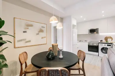 a living room with a couch and a table at Acciaroli - 2 bedrooms and terrace in Ciutat Vella in Barcelona