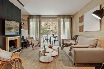 a bedroom with a large bed and a table at Liang - 3 bedrooms in Eixample Esquerra in Barcelona