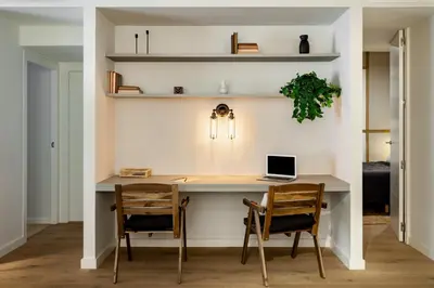 a living room with a table and two chairs at Liang - 3 bedrooms in Eixample Esquerra in Barcelona