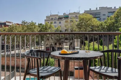 a bedroom with a bed and a table and a desk at Punta - 3 bedrooms with pool in Les Corts in Barcelona