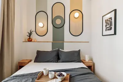 a living room with a tv and a table at Asmali - 2 bedrooms and terrace in Sant Pere in Barcelona