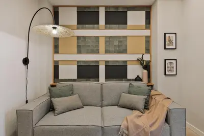 a small bedroom with a bed and a window at Asmali - 2 bedrooms and terrace in Sant Pere in Barcelona