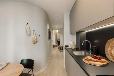a living room with a table and chairs at Asmali - 2 bedrooms and terrace in Sant Pere in Barcelona