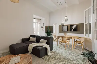 a living room with a couch and a table at Pegaso - 2 bedrooms and terrace in Sant Gervasi in Barcelona