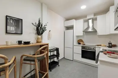 a living room with a table and a couch at Pegaso - 2 bedrooms and terrace in Sant Gervasi in Barcelona