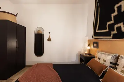a bedroom with a large bed and two lamps at Afrera - 2 bedrooms and terrace in Sant Gervasi in Barcelona