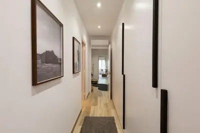a bathroom with a sink and a toilet and a mirror at Afrera - 2 bedrooms and terrace in Sant Gervasi in Barcelona