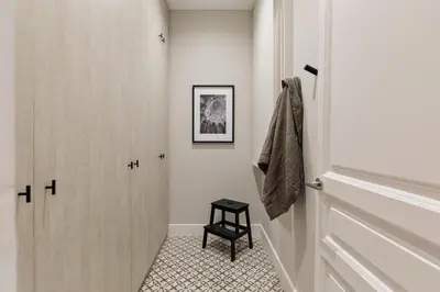 a hallway with a mirror and a plant on a table at Maslak - 2 bedrooms in Eixample Antiga in Barcelona