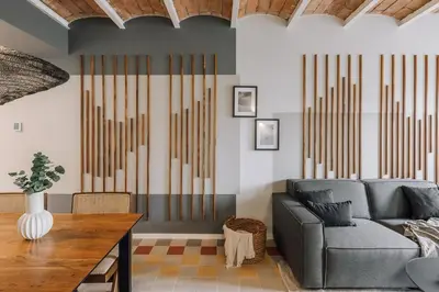 a living room with a couch and a table at Tauca - 2 bedrooms and office in Eixample Dreta in Barcelona