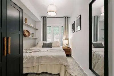 a bedroom with a bed and a mirror at Canneti - 3 bedrooms in Sagrada Família in Barcelona
