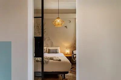a bathroom with a sink and a toilet and a mirror at Takari - 1 bedroom and balcony in Gràcia in Barcelona