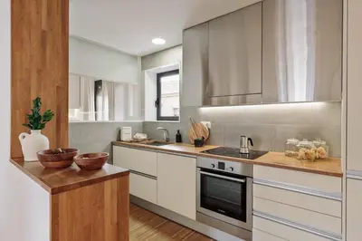 a bathroom with a toilet and a sink and a mirror at Celoni - 1 bedroom and office in Sagrada Família in Barcelona