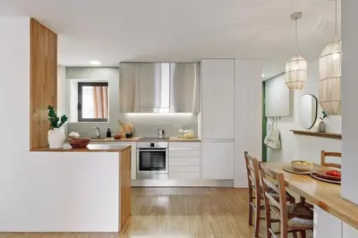 a living room with a couch and a tv at Celoni - 1 bedroom and office in Sagrada Família in Barcelona