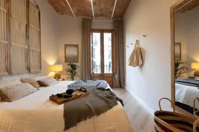 a bedroom with two beds with a tray on the bed at Malay - 3 bedrooms in Eixample Dreta in Barcelona