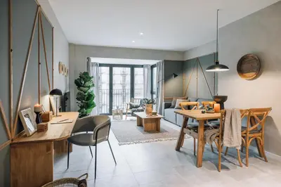 a living room with a table and a dining room at Sare - 3 bedrooms in Eixample Esquerra in Barcelona