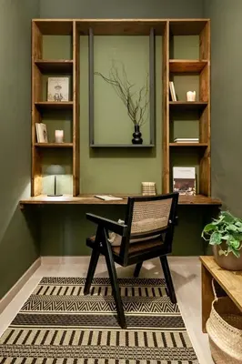 a desk with a chair in a room with green walls at Lendu - 2 bedrooms and balcony in Sant Antoni in Barcelona