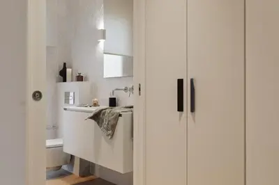 a bedroom with a bed with a book on it at Karakoy - 2 bedrooms and balcony in Eixample Dreta in Barcelona