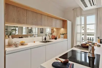a bathroom with a sink and a toilet and a mirror at Karakoy - 2 bedrooms and balcony in Eixample Dreta in Barcelona