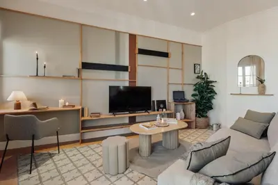 a bedroom with a bed and a desk with a chair at Karakoy - 2 bedrooms and balcony in Eixample Dreta in Barcelona