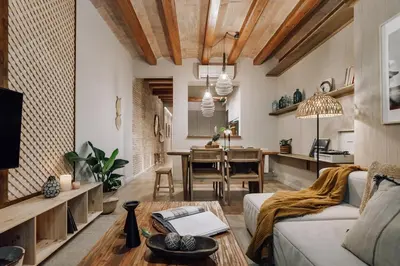 a bedroom with a large bed with a tray on it at Sande - 2 bedrooms and balcony in Eixample Dreta in Barcelona